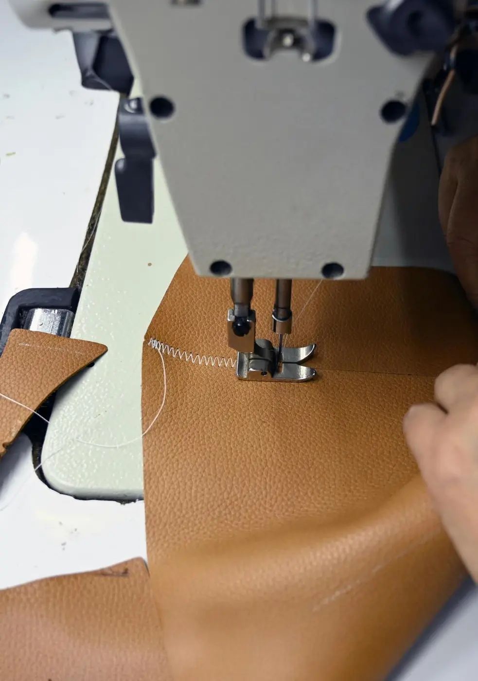 Precision stitching of full grain leather at Cosmic Bag Industries